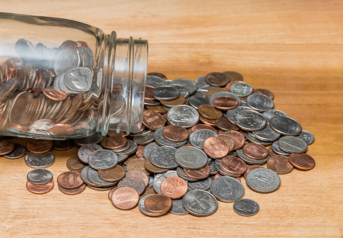 spare change jar tipped over spilling out
