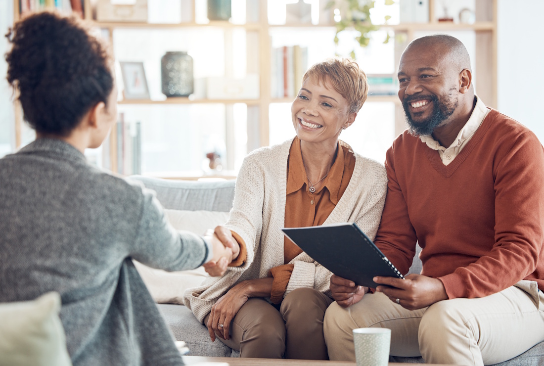 A couple are  reviewing documents with a tax professional