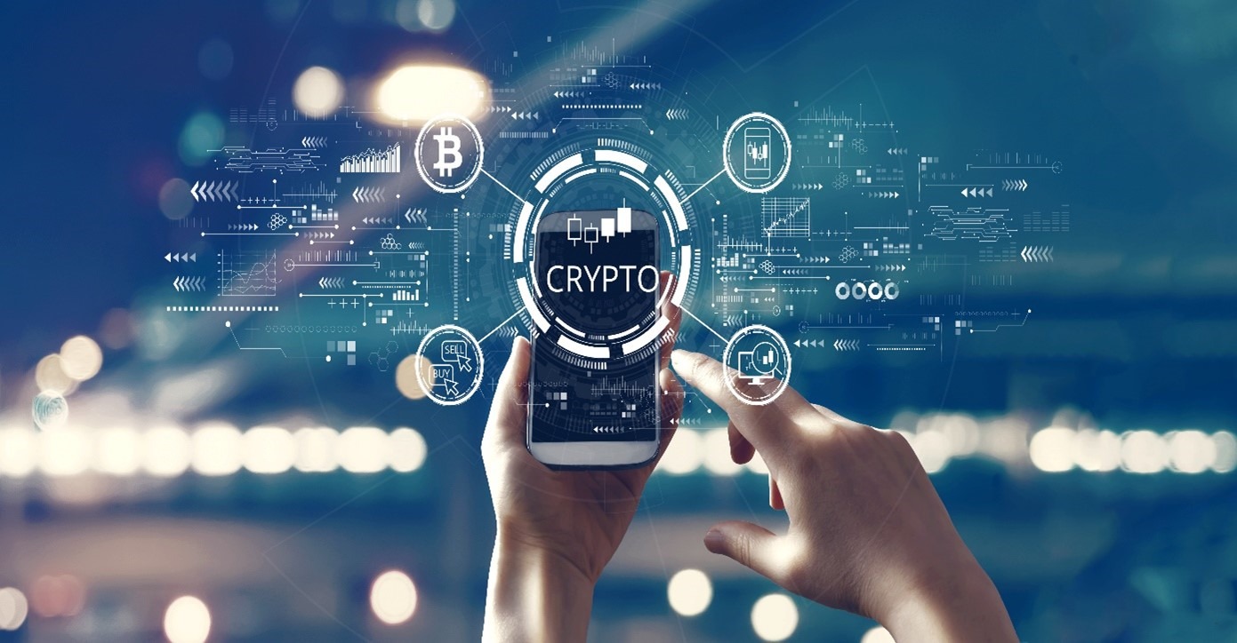 Hands holding smartphone displaying cryptocurrency icons and blockchain network connections with Bitcoin and crypto symbols on digital interface