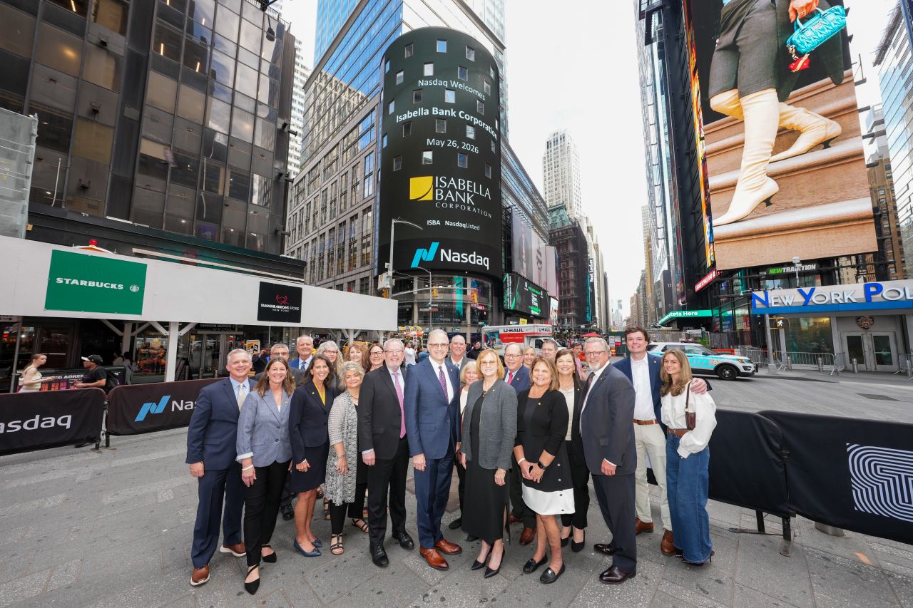 Isabella Bank Leadership Team and Board in Front of Nasdaq Tower Video Board in Times Square New York City