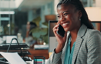 Woman smiling talking on smartphone