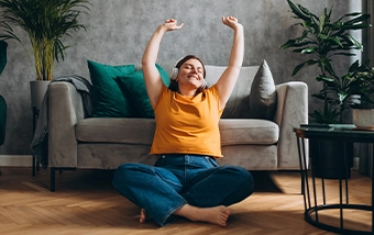 young woman celebrating simplifying subscriptions