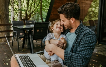 Father and son on a laptop