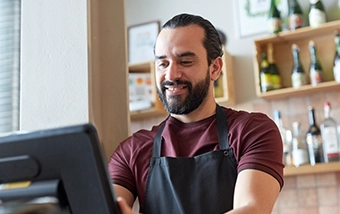 Business owner using a point of sale system