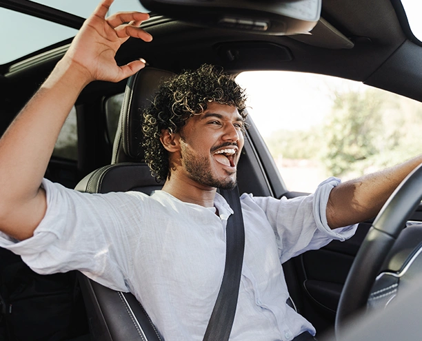 young man driving a vehicle