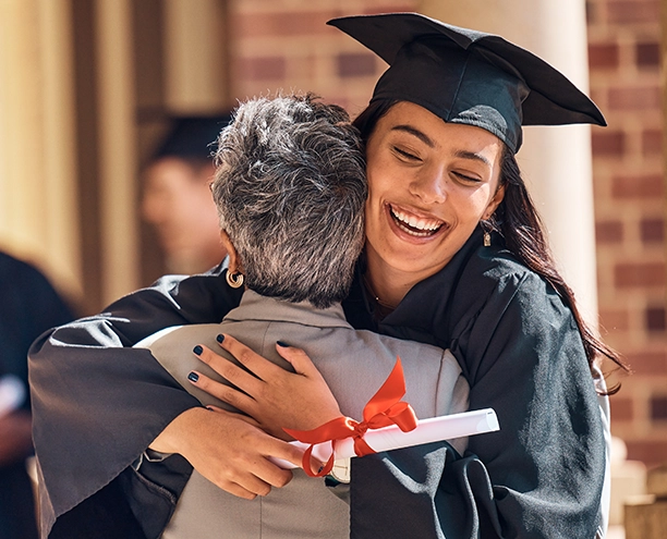 A mother and daughter celebrating on their graduation day