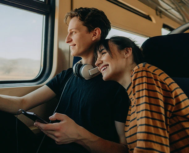 young couple traveling together on a train
