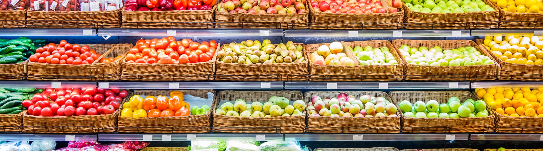 Grocery store shelves stocked with fruit