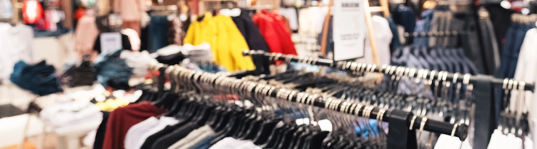 A store clothing rack with hanging shirts