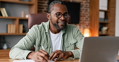 Man working enthusiastically at his computer