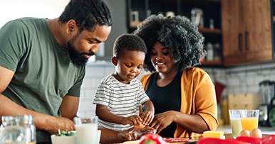 family cooking a meal together in the kitchen