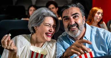 Senior couple enjoying popcorn