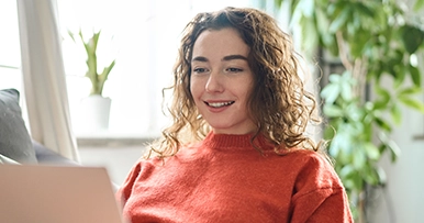 Young woman using a laptop computer at home