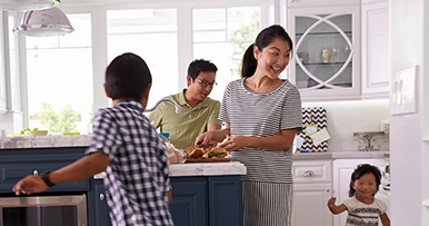 Happy family enjoying new kitchen renovation