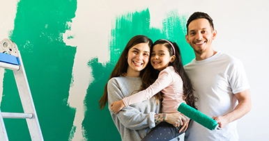 Family painting walls