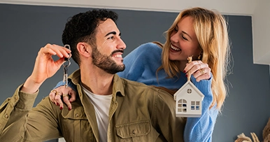 Young couple celebrating house purchase