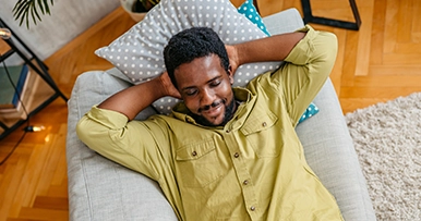 Man relaxing on new furniture