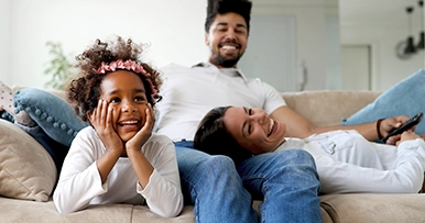 family hanging out together on new furniture