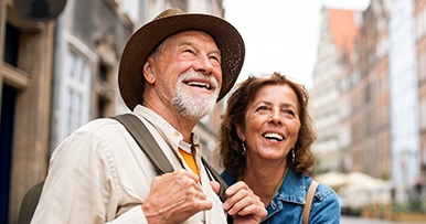 mature tourist couple exploring new city